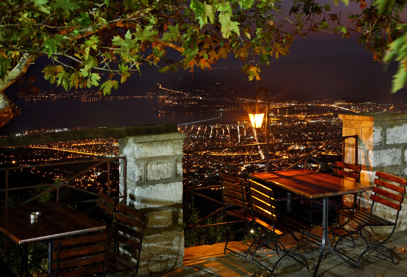Night view of Volos city representing transport routes and travel destinations in the area